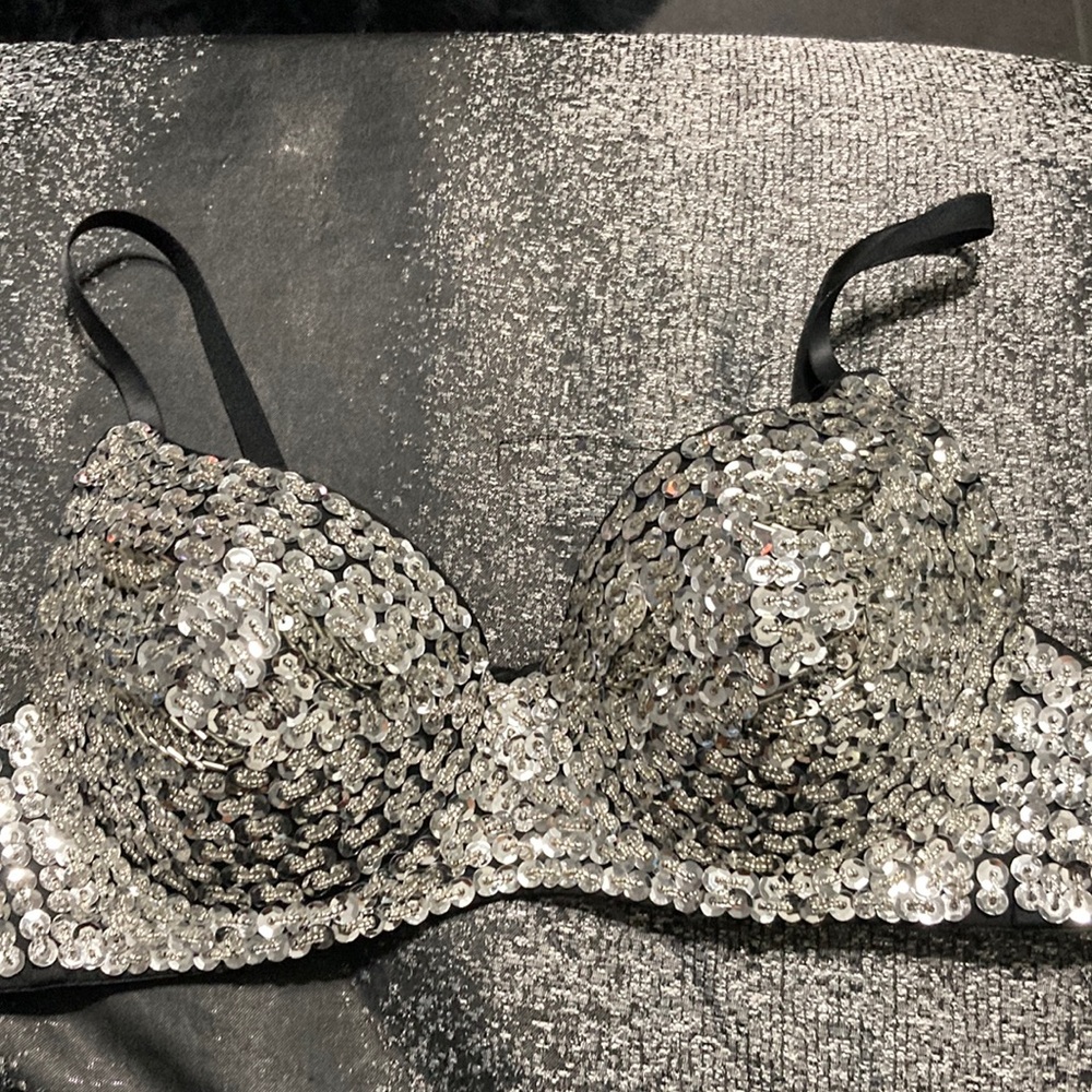 Silver sequins over black bralette